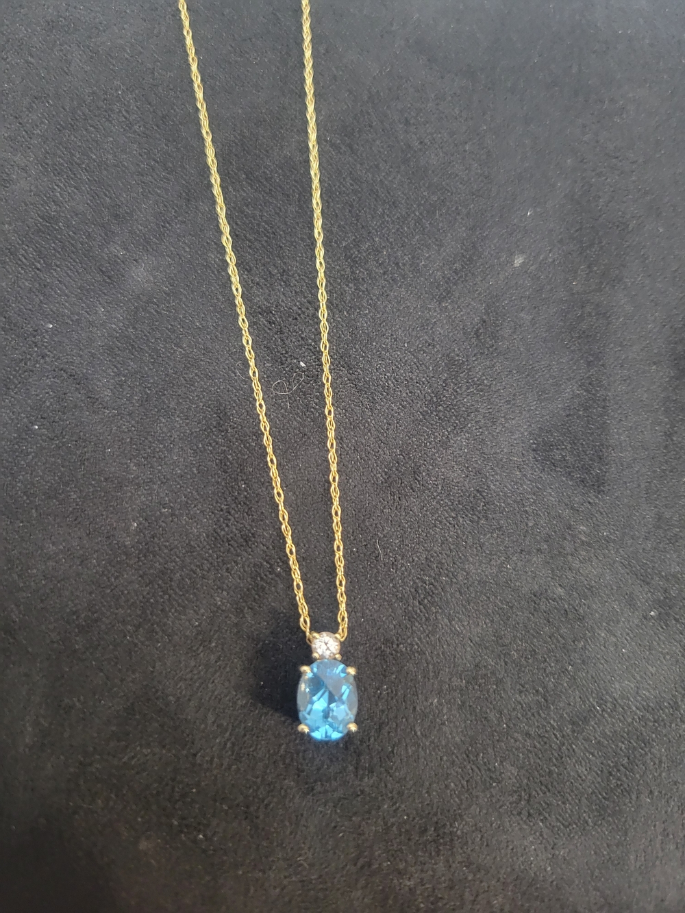 9k Gold Necklace With Blue And White Topaz Pendant